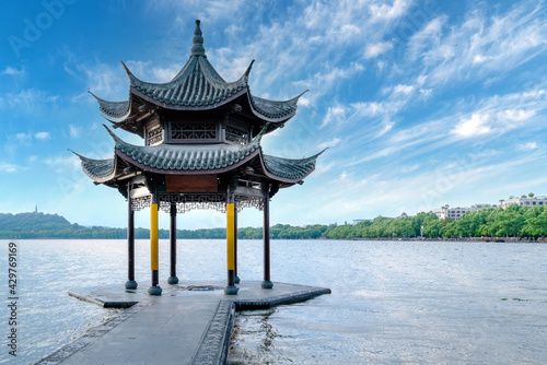 chinese ancient pavilion on the west lake in hangzhou.Translation:"Gathering the saint's pavilion"