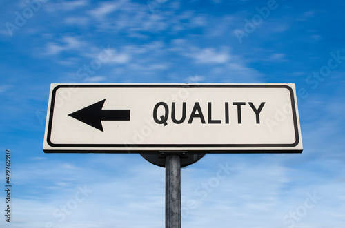 Quality road sign, arrow on blue sky background. One way blank road sign with copy space. Arrow on a pole pointing in one direction. photo
