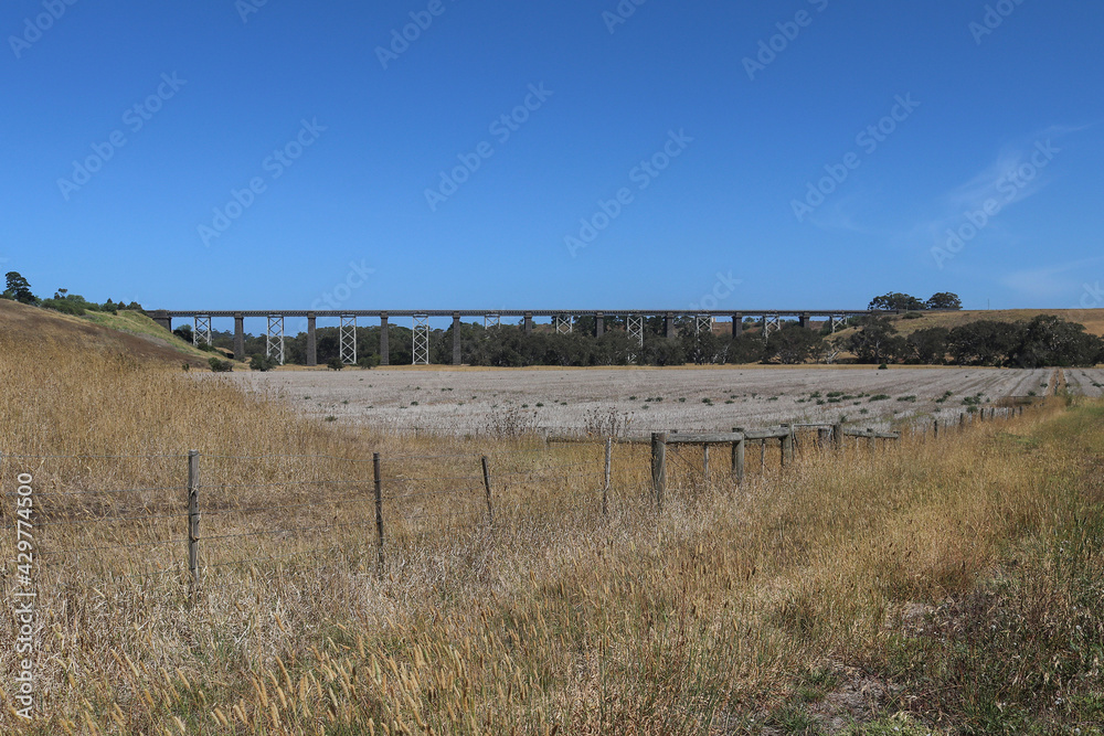 The historic 440-metre long Moorabool Viaduct (1862) is a bluestone and iron bridge that was built to carry the Geelong-Ballarat railway over the river valley