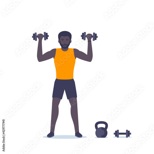 Man training shoulders, workout with dumbbells