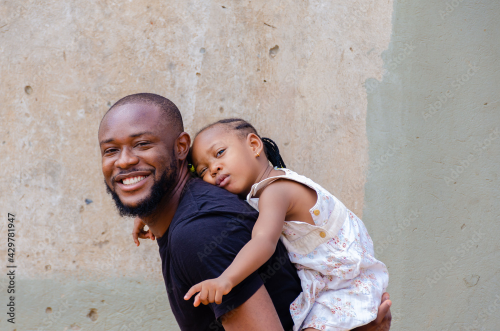 handsome african dad feeling excited as he is bonding with his daughter