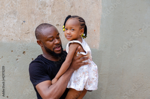 african dad feeling excited as he is bonding with his daughter