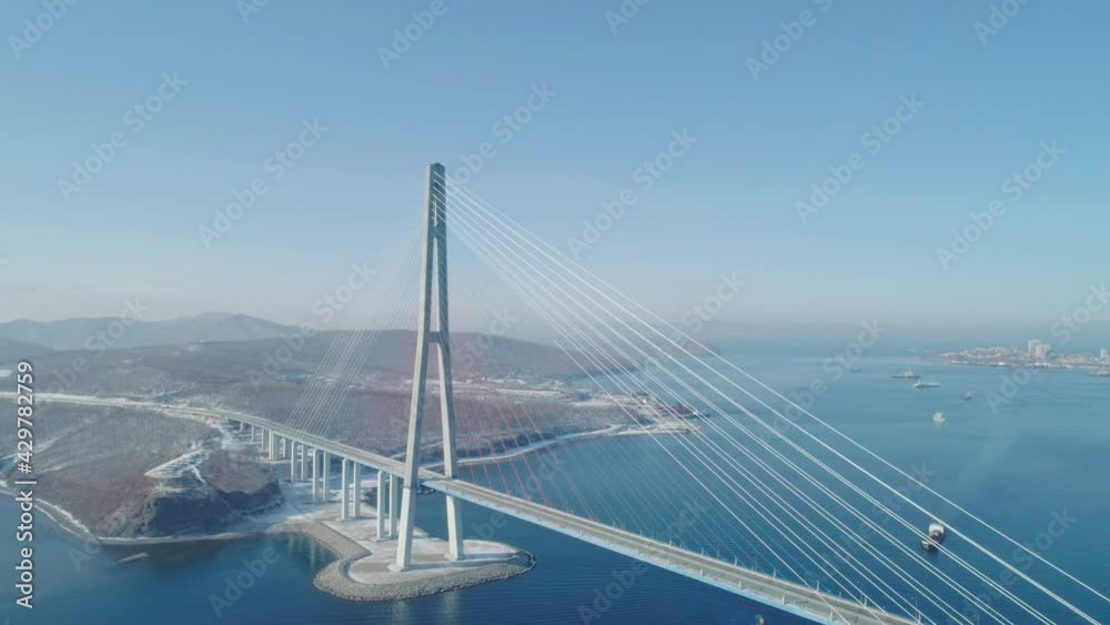 Aerial over the Russky road bridge pillar. Bridge across the Eastern Bosphorus to Russky Island. Aerial over the Russky road bridge pillar. Bridge across the Eastern Bosphorus to Russky Island.
