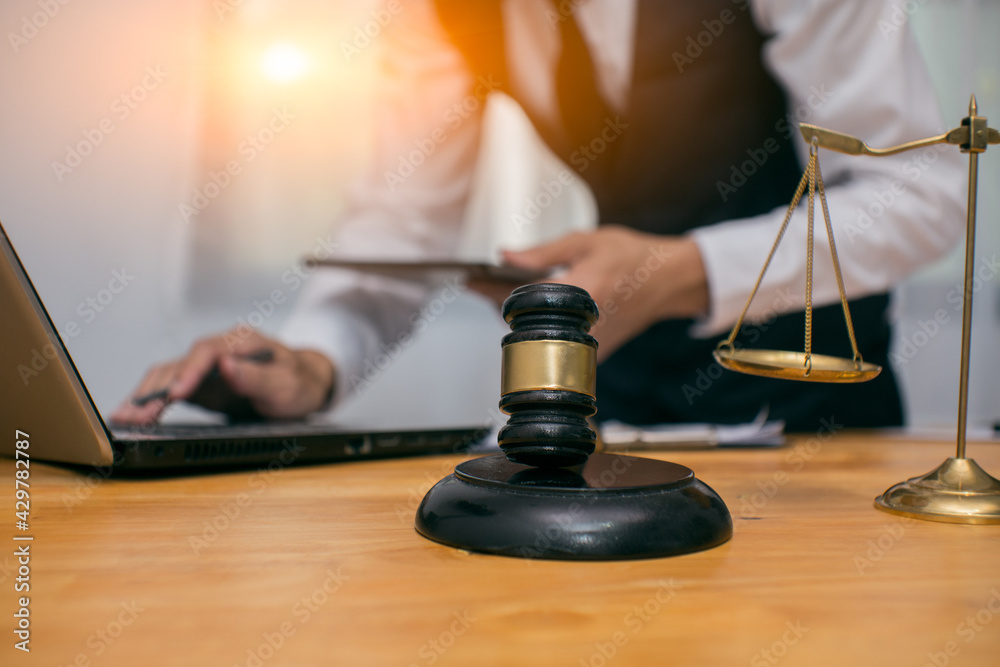 Male lawyer or judge wearing protective mask on the consult having team meeting with client, Law and Legal services concep Male lawyer or judge wearing protective mask on the consult having team meeting with client, Law and Legal services concep