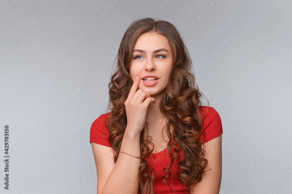 Dreamy young brunette woman, looking aside thoughtful, imaging or pondering about something Dreamy young brunette woman, looking aside thoughtful, imaging or pondering about something