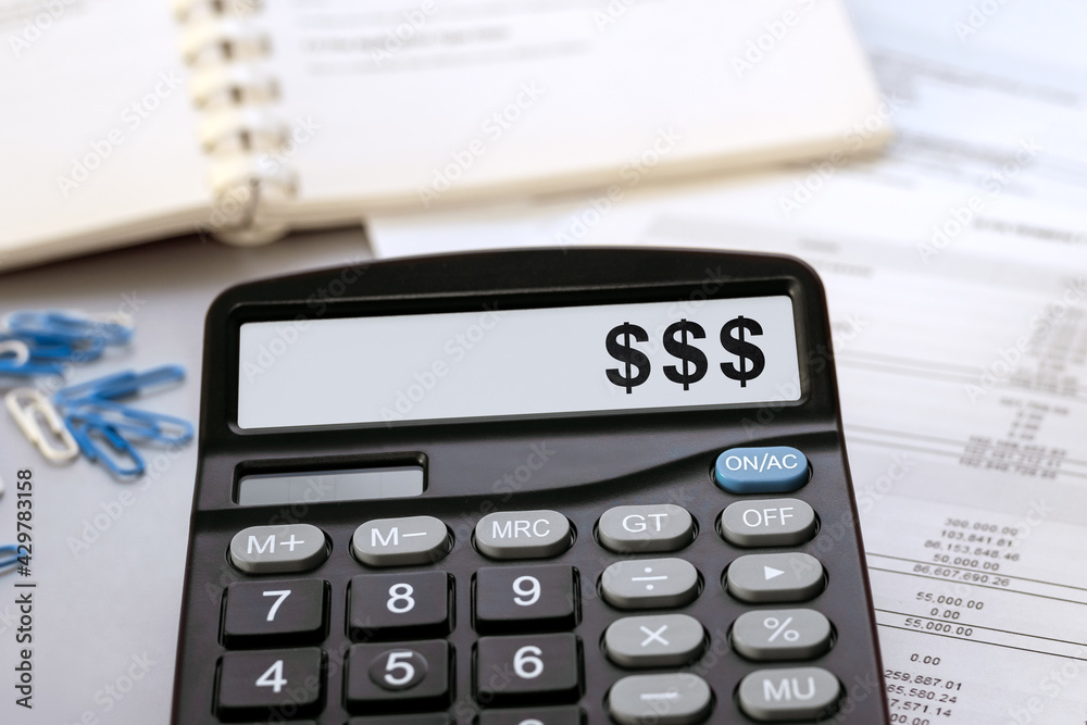 Calculator with the words money symbol on the display Calculator with the words money symbol on the display