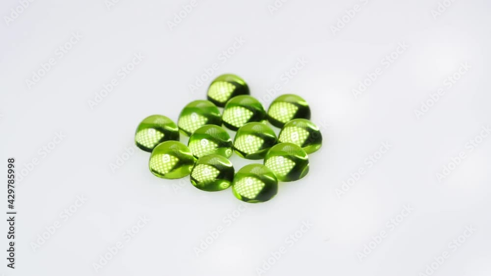 natural peridot gemstone on the white background on the turning table natural peridot gemstone on the white background on the turning table