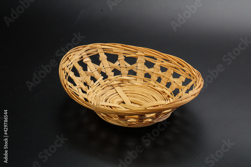 Natural wicker tableware for serving over black