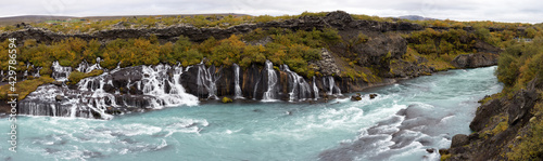 Unusual blue waterfall in Iceland Hraunfossar