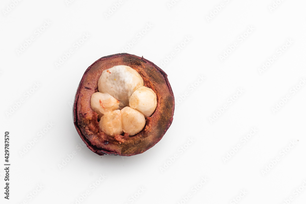 Isolated tropical fruits. One whole mangosteen isolated on white with clipping path.