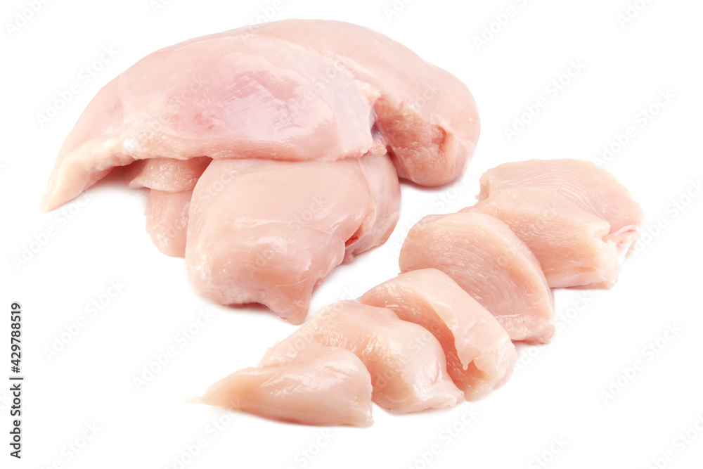 Fresh raw chicken breast fillet whole and sliced isolated closeup on white background, clipping path