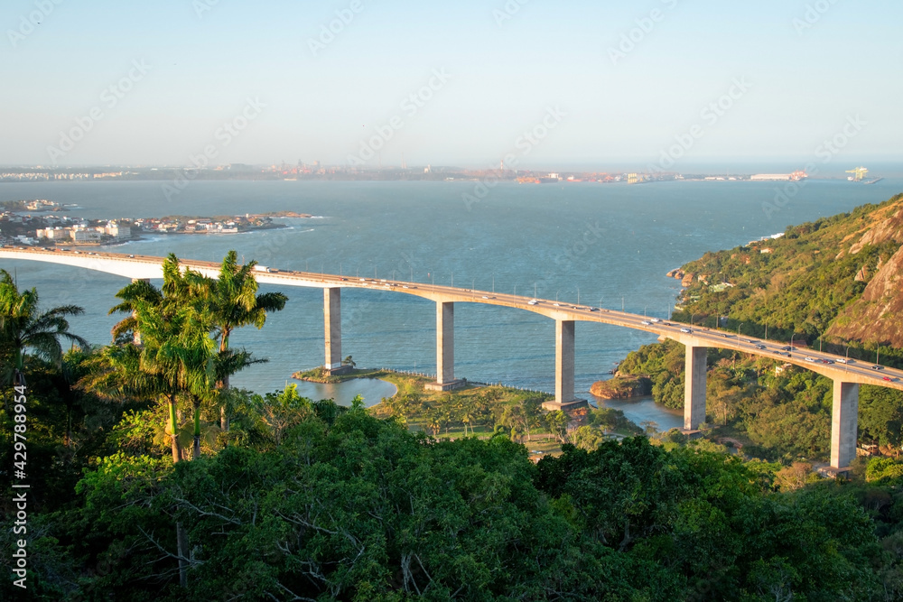 aerial view of the bridge over the sea and tropical trees