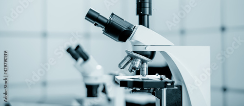 Photography Toned photo of scientific trinocular microscope with camera in science laborator