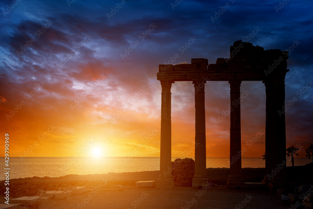 Fototapeta premium Architectural columns from the times of ancient greece. Ruins against the sunset sky. Side turkey