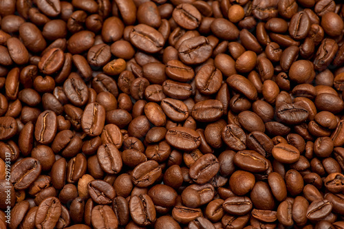 Roasted coffee beans  top view. Dark background