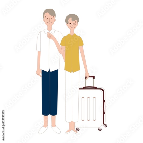 スーツケースを持って旅行するシニア男女
