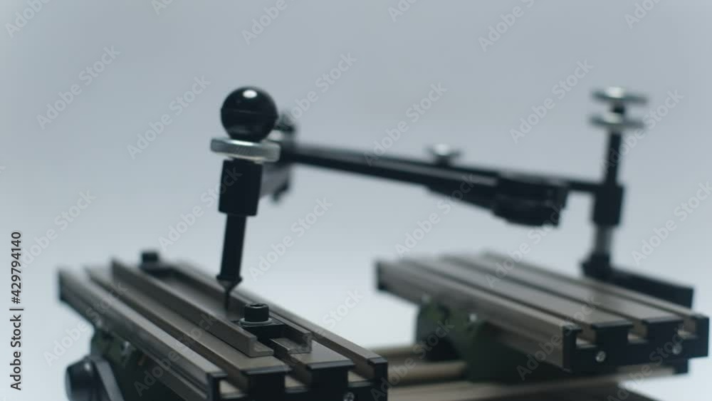 Engraving device pantograph rotating on white background Engraving device pantograph rotating on white background