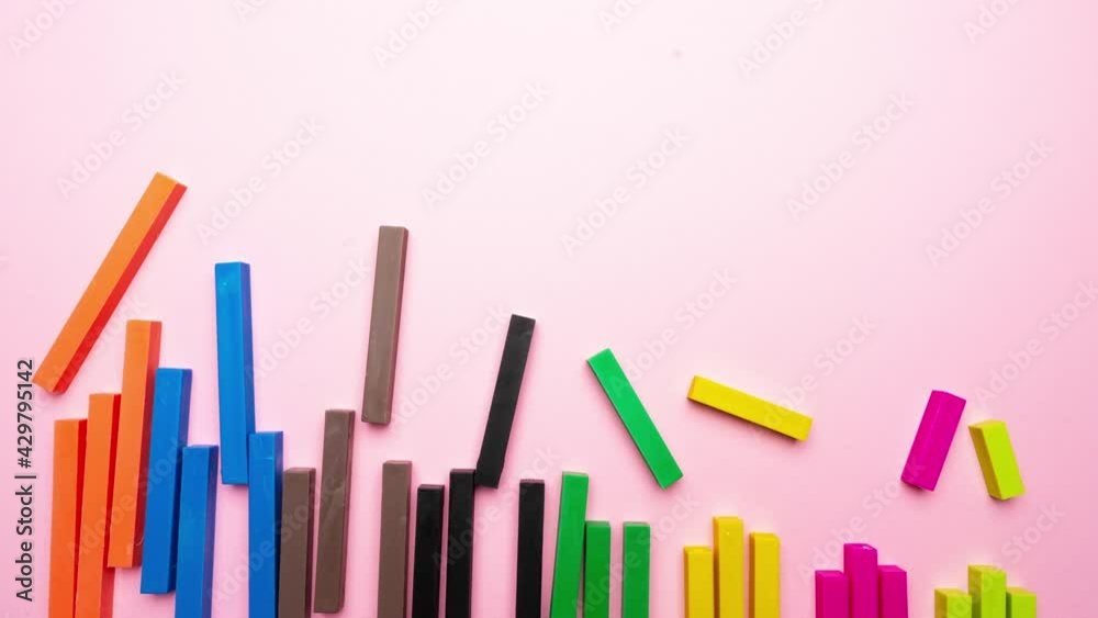 stop motion movie with a composition made with colored bars that is composed in order on a colored surface stop motion movie with a composition made with colored bars that is composed in order on a colored surface