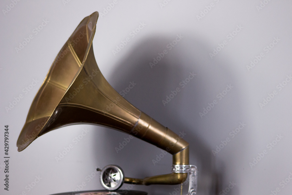 Old gramophone with a plate record. Portable wind-up gramophone. Patephone Old gramophone with a plate record. Portable wind-up gramophone. Patephone