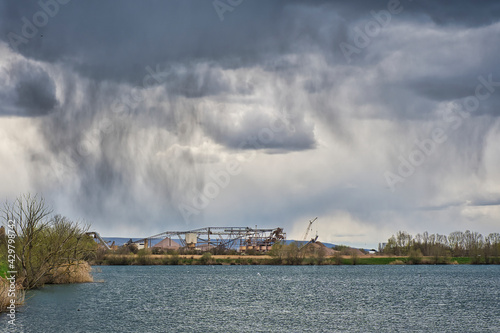 rain clouds over a lake © Kurt Lue