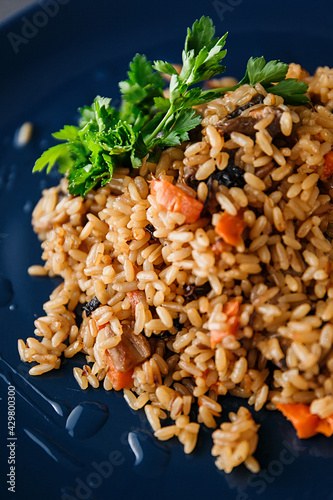 Asian-style rice with howy sauce, vegetables and herbs photo