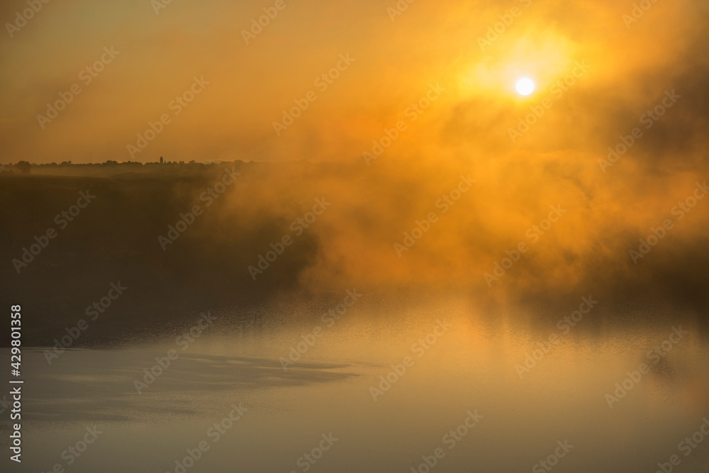 sunset sunrise in mist with lake and hills sunset sunrise in mist with lake and hills