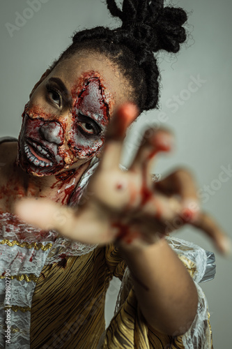 Model posing as a zombie halloween theme