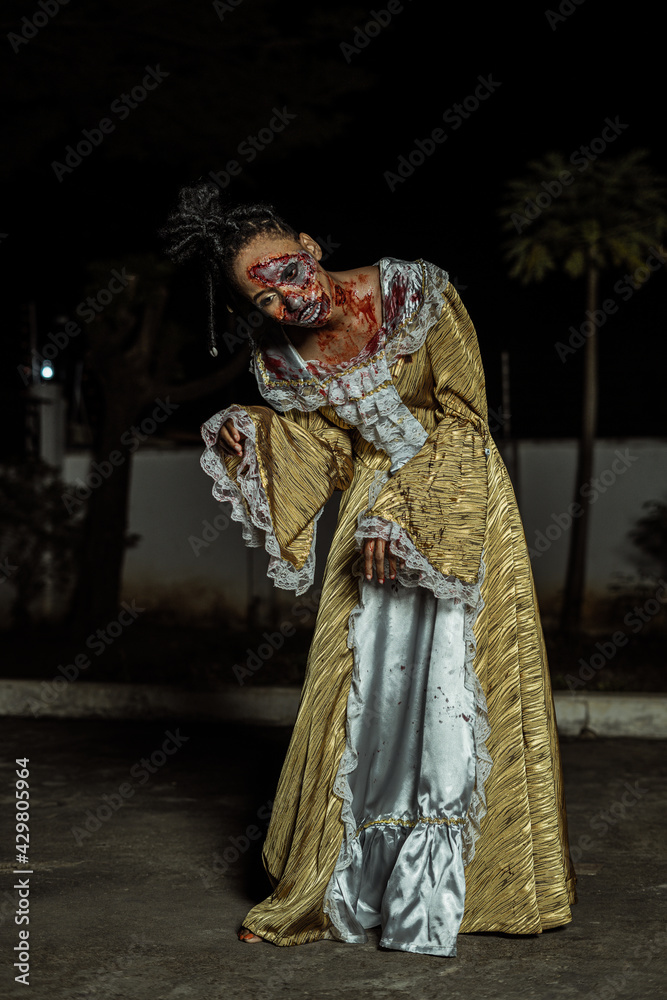 Model posing as a zombie halloween theme