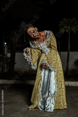 Model posing as a zombie halloween theme