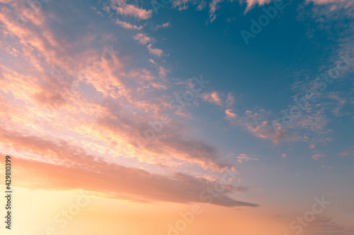 Beautiful sunset sky with clouds. Twilight heaven background.