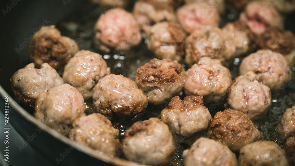 Meat balls are fried in a frying pan in oil. The cooking process. Delicious food. Meat balls are fried in a frying pan in oil. The cooking process. Delicious food.