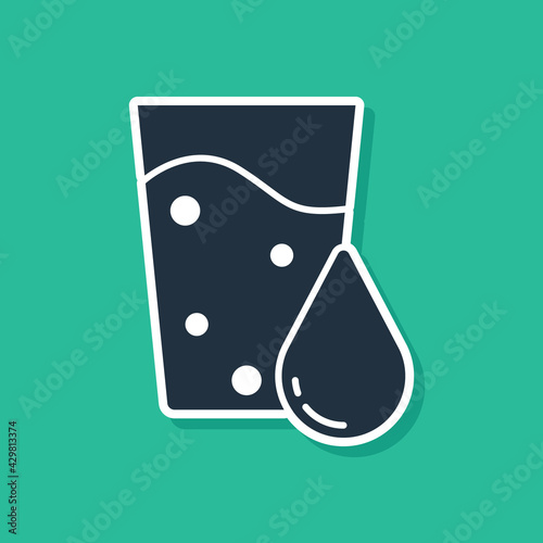 Blue Glass with water icon isolated on green background. Soda glass. Vector