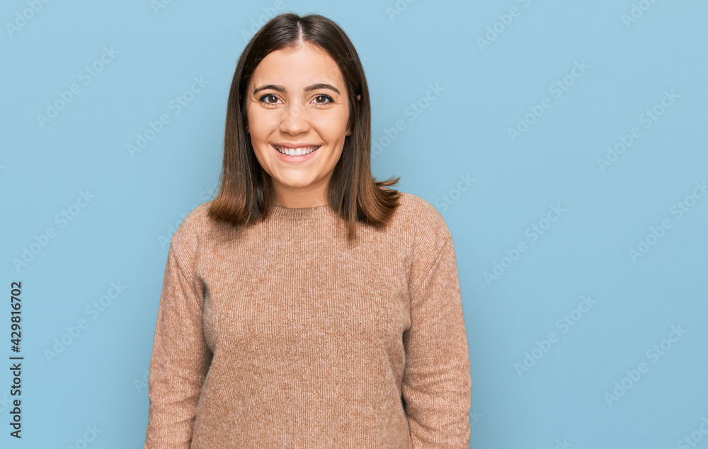 Young beautiful woman wearing casual clothes with a happy and cool smile on face. lucky person. Young beautiful woman wearing casual clothes with a happy and cool smile on face. lucky person.