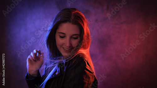 Strong colorful portrait shot of a young woman - studio photography