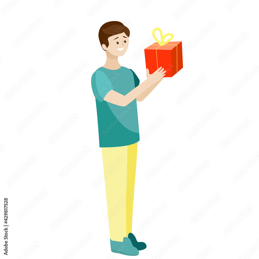 A boy with a gift in his hands is smiling.