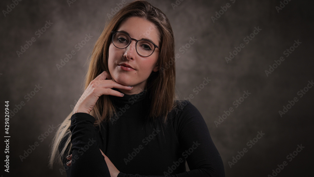 Fototapeta premium Young pretty woman in her mid 20s - portrait shot - studio photography