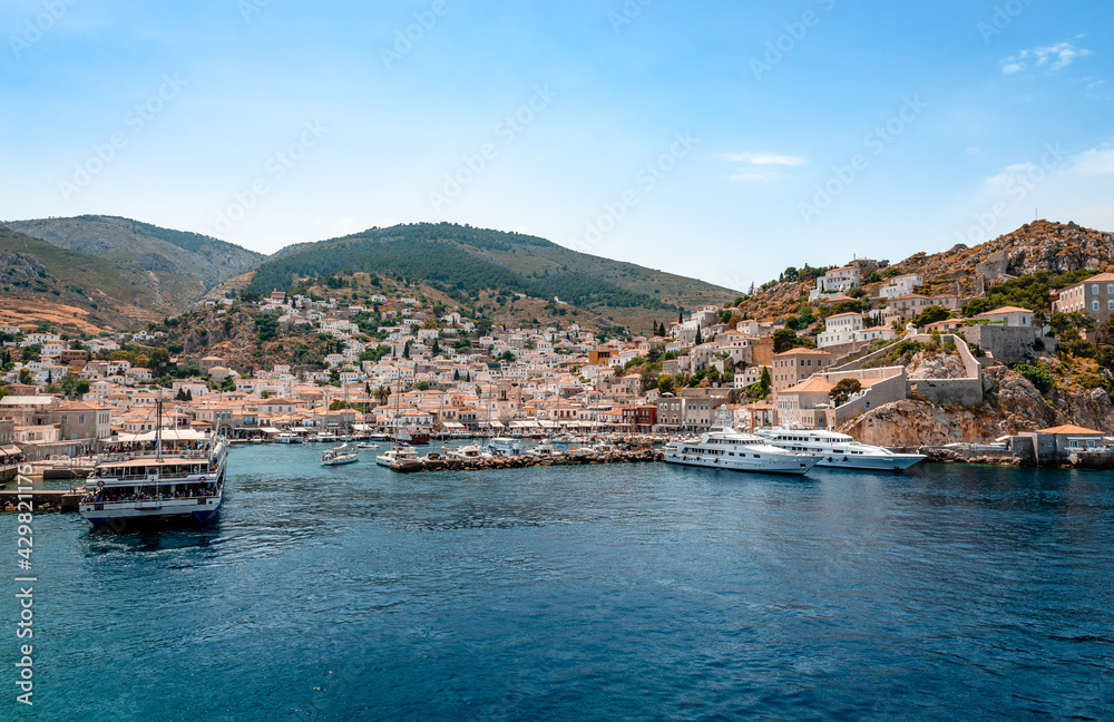 View of the crescent-shaped port and the village of Hydra. Hydra is a small picturesque island in Saronic gulf and a popular tourist destination.
