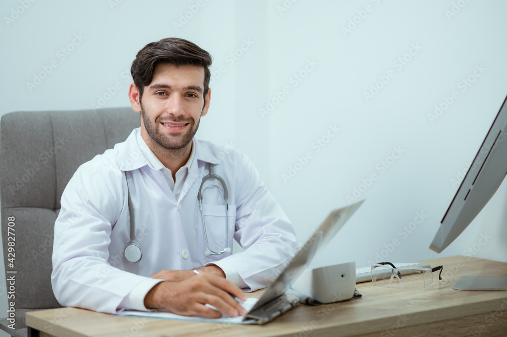 Doctor who specializes in cosmetic surgery looks at the camera with a smile. Doctor who specializes in cosmetic surgery looks at the camera with a smile.