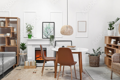 Interior of modern dining room with fireplace