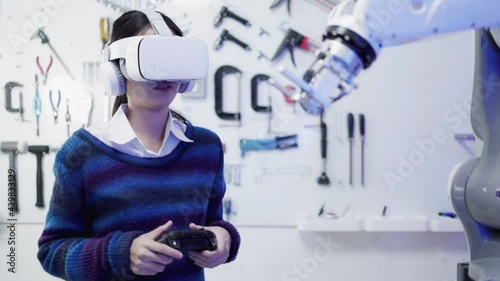 Concept of virtual reality, simulation, Robot arm and future technology.Asian Engineers Maintenance Robot Arm at Lab. they are in a High Tech Research Laboratory with Modern Equipment. 