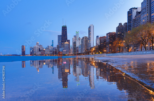 Chicago skyline after sunset showing Chicago downtown viewing from North Avenue beach . Chicago, on Lake Michigan in Illinois, is among the largest cities in the U.S.  © jayyuan
