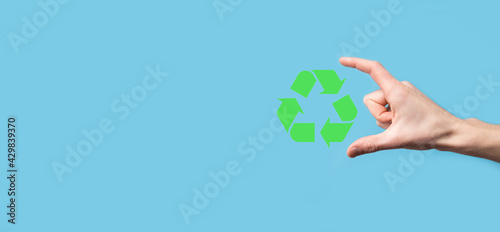 Hand hold recycling icon.Ecology and renewable energy concept.ECO sign, Concept Save green planet. Symbol of environmental protection.Recycling waste.Symbol of earth day, concept of nature protection