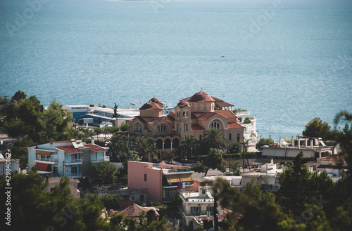 sea view coast in summer residential buildings and cathedral Greek city of Chalkis photo