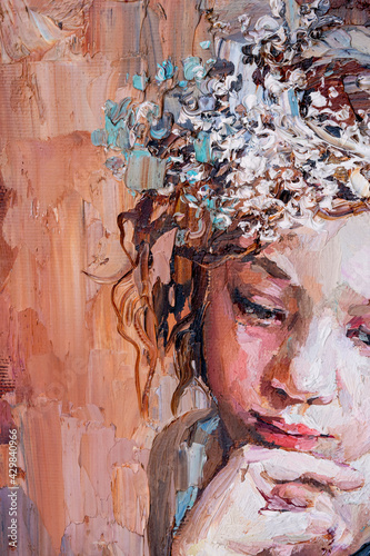 Fototapeta Naklejka Na Ścianę i Meble -  Fragment of a portrait of a young, dreamy girl with flowers in curly brown hair. The oil painting is created in oil with expressive strokes.
