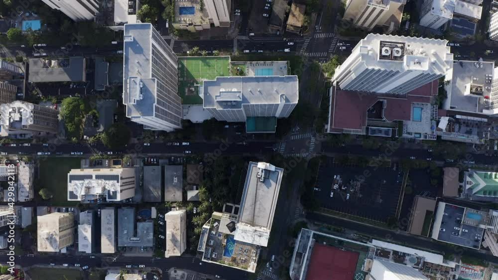 Aerial top down view of downtown street in Waikiki, Honolulu. Urban grid with tall buildings and parks, Hawaii Aerial top down view of downtown street in Waikiki, Honolulu. Urban grid with tall buildings and parks, Hawaii
