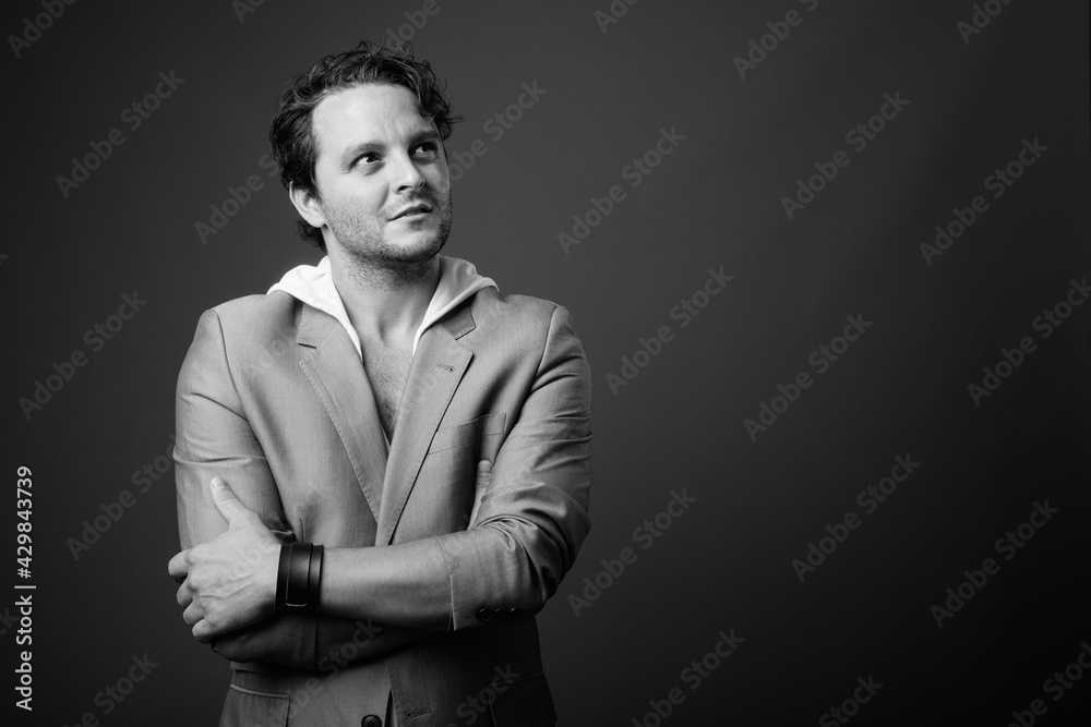 Studio shot of Italian businessman in black and white Studio shot of Italian businessman in black and white