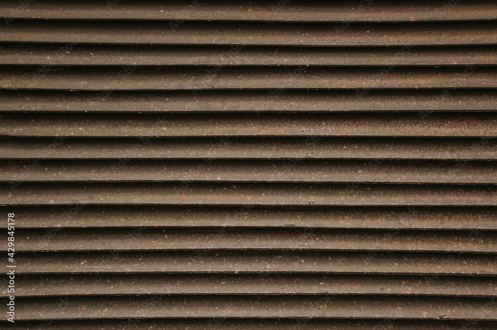 Pattern. The texture of the wall made of slats. Wooden striped wall.