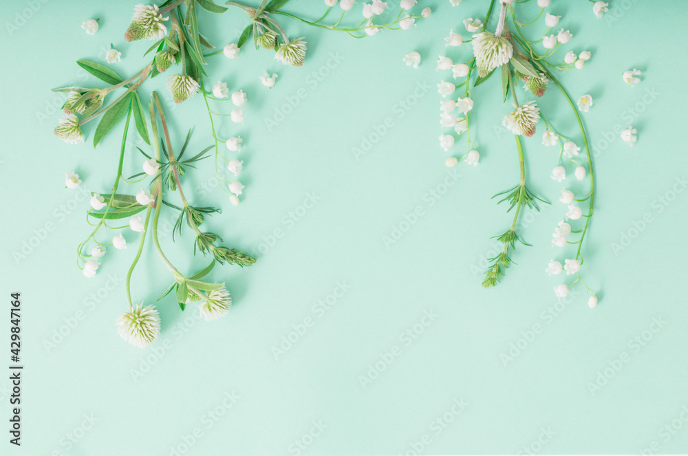 wild flowers on green paper background