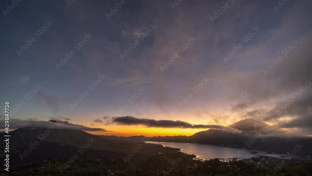 Landscape of Mount Batur Volcano and Lake in Kintamani, Bali, Indonesia - Morning Sunrise Time Lapse Landscape of Mount Batur Volcano and Lake in Kintamani, Bali, Indonesia - Morning Sunrise Time Lapse