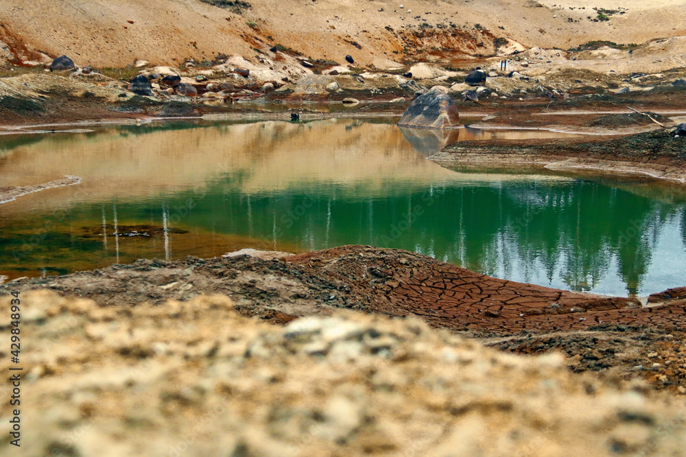 Dirty bottom of a dried-up lake. Ecological problems. Dirty bottom of a dried-up lake. Ecological problems.